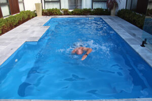 Man swimming in heated pool in canberra
